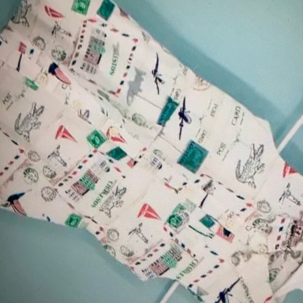 Print collared button front down sleeveless blouse